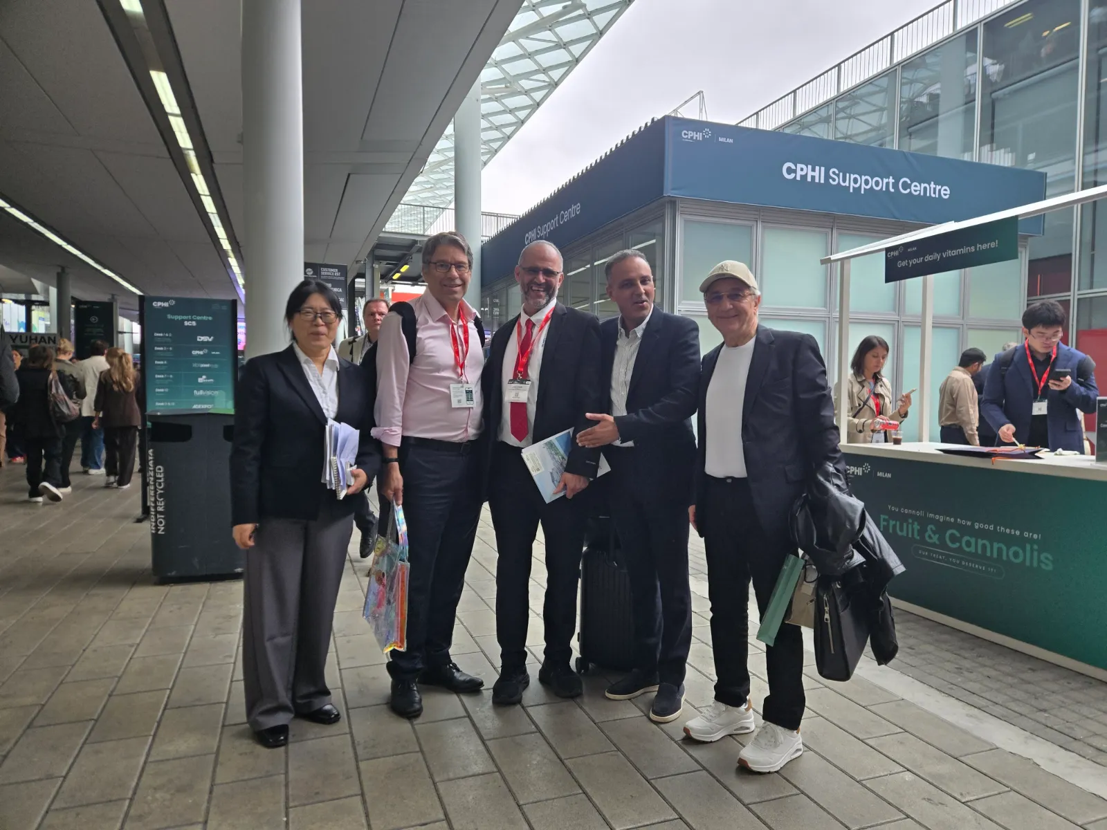 Dr. Aziz Chraibi with attendees in front of the CPHI Support Centre in Milan