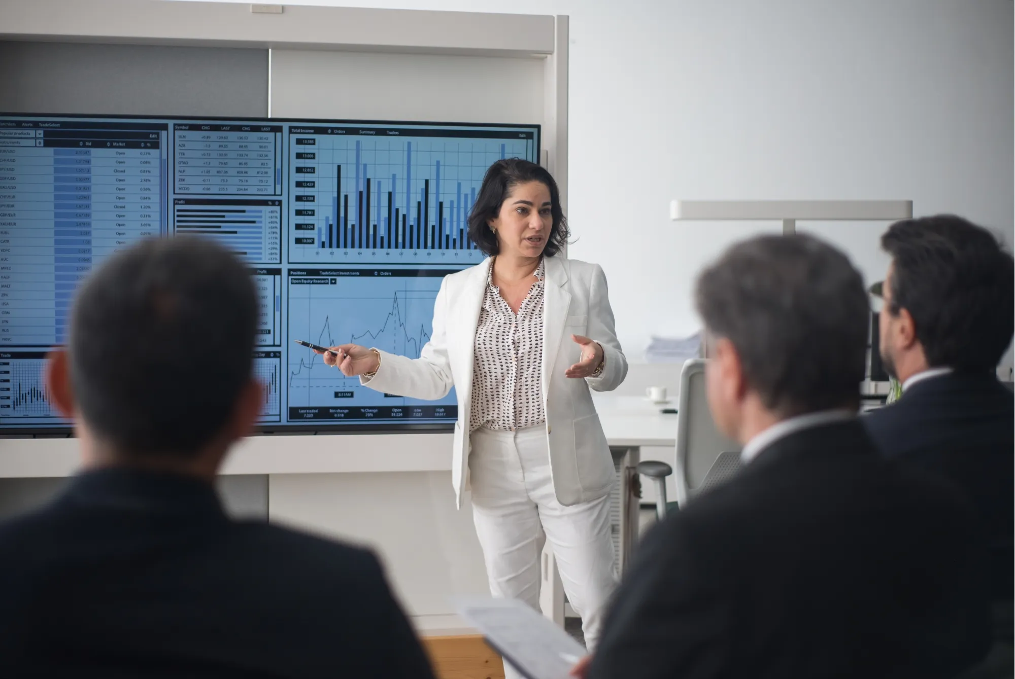 A trainer in front of a group in a training room