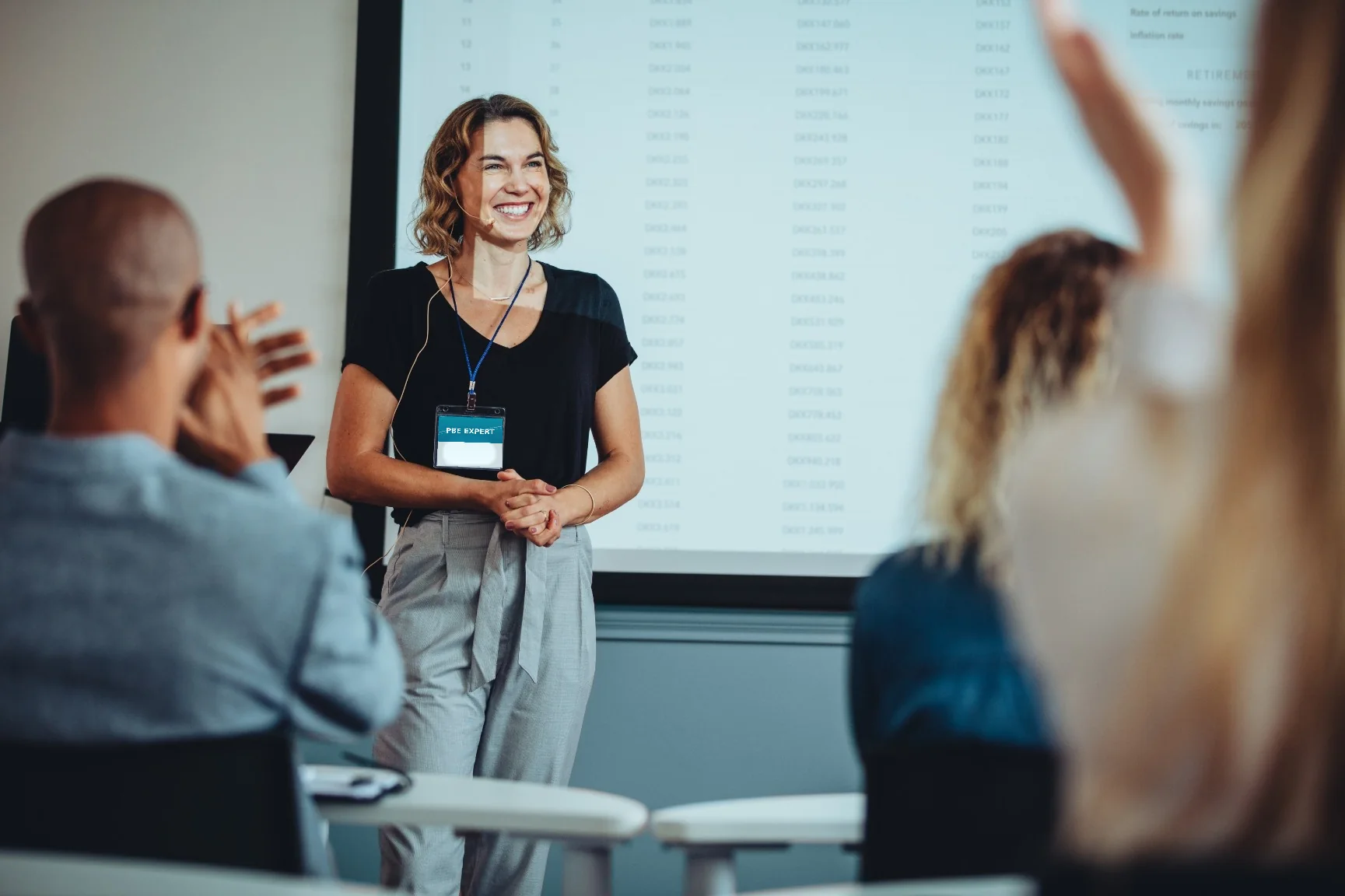 A trainer leads a session for a group of professionals