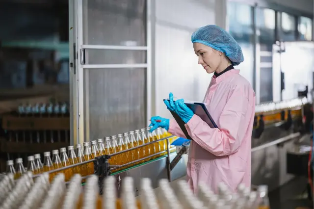 Technician checking a filling line