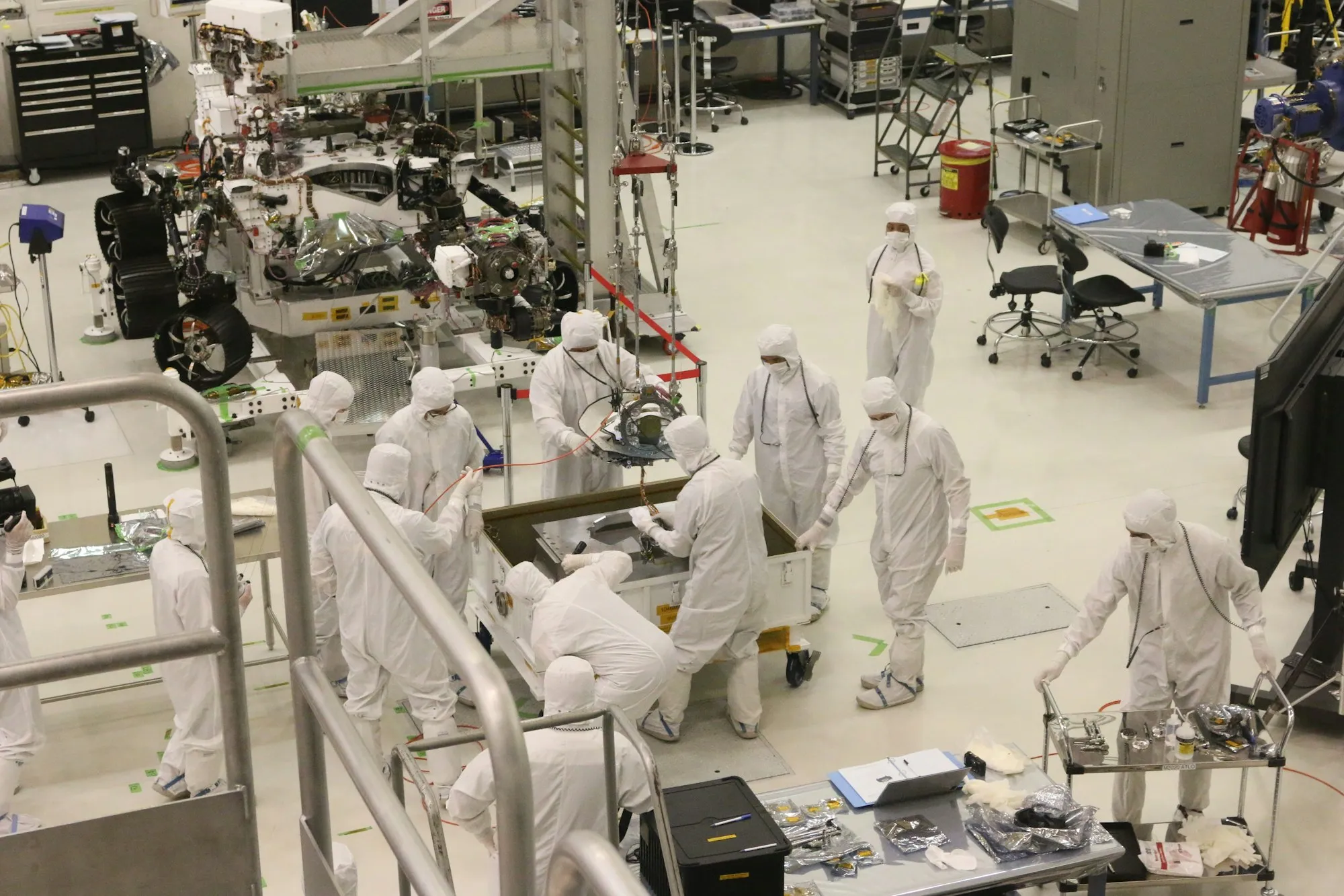Staff in cleanroom garments in a production unit
